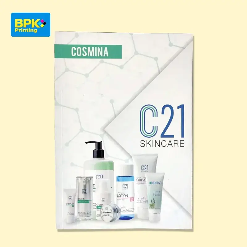 หน้าปกแคตตาล็อกผลิตภัณฑ์ C21 Skincare แบรนด์ COSMINA แสดงภาพรวมของผลิตภัณฑ์ดูแลผิวหลากหลายชนิดบนพื้นหลังสีขาวสะอาดตา พร้อมโลโก้ C21 ขนาดใหญ่ดึงดูดสายตา