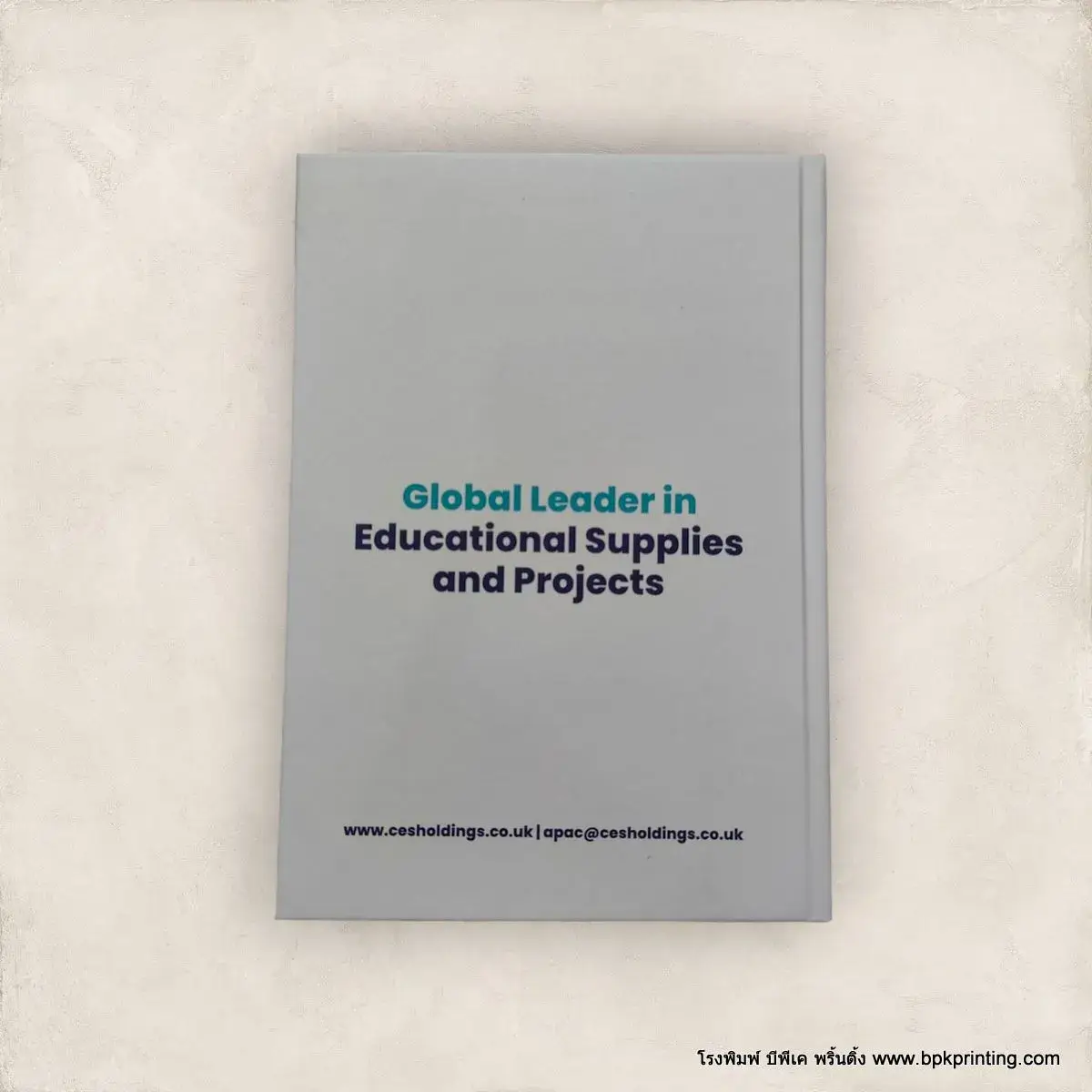 หนังสือปกแข็งสีเทาออกแบบเรียบหรูสำหรับองค์กรระดับสากล Global Leader in Educational Supplies and Projects พิมพ์คุณภาพสูงโดยโรงพิมพ์ BPK Printing เหมาะสำหรับใช้ในงานพรีเซนต์บริษัท เอกสารแนะนำองค์กร หรือรายงานโครงการอย่างมืออาชีพ